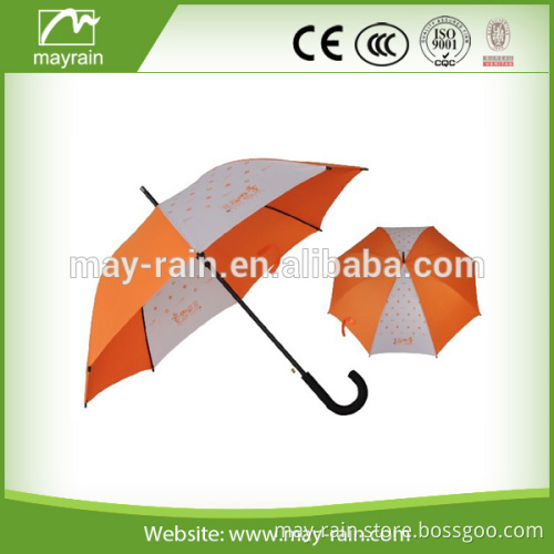 orange and white dot printed outdoor umbrella